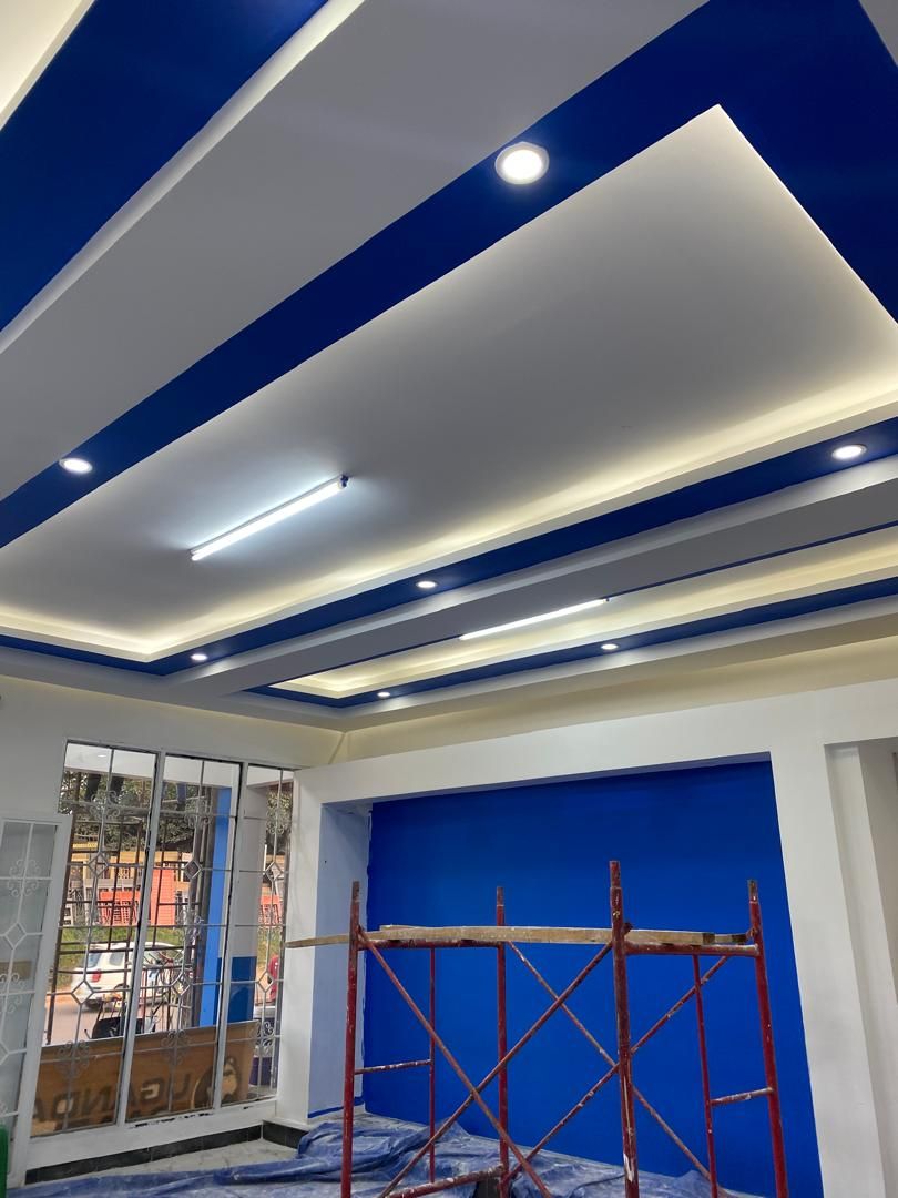 Commercial ceiling with blue and white cove lighting detail