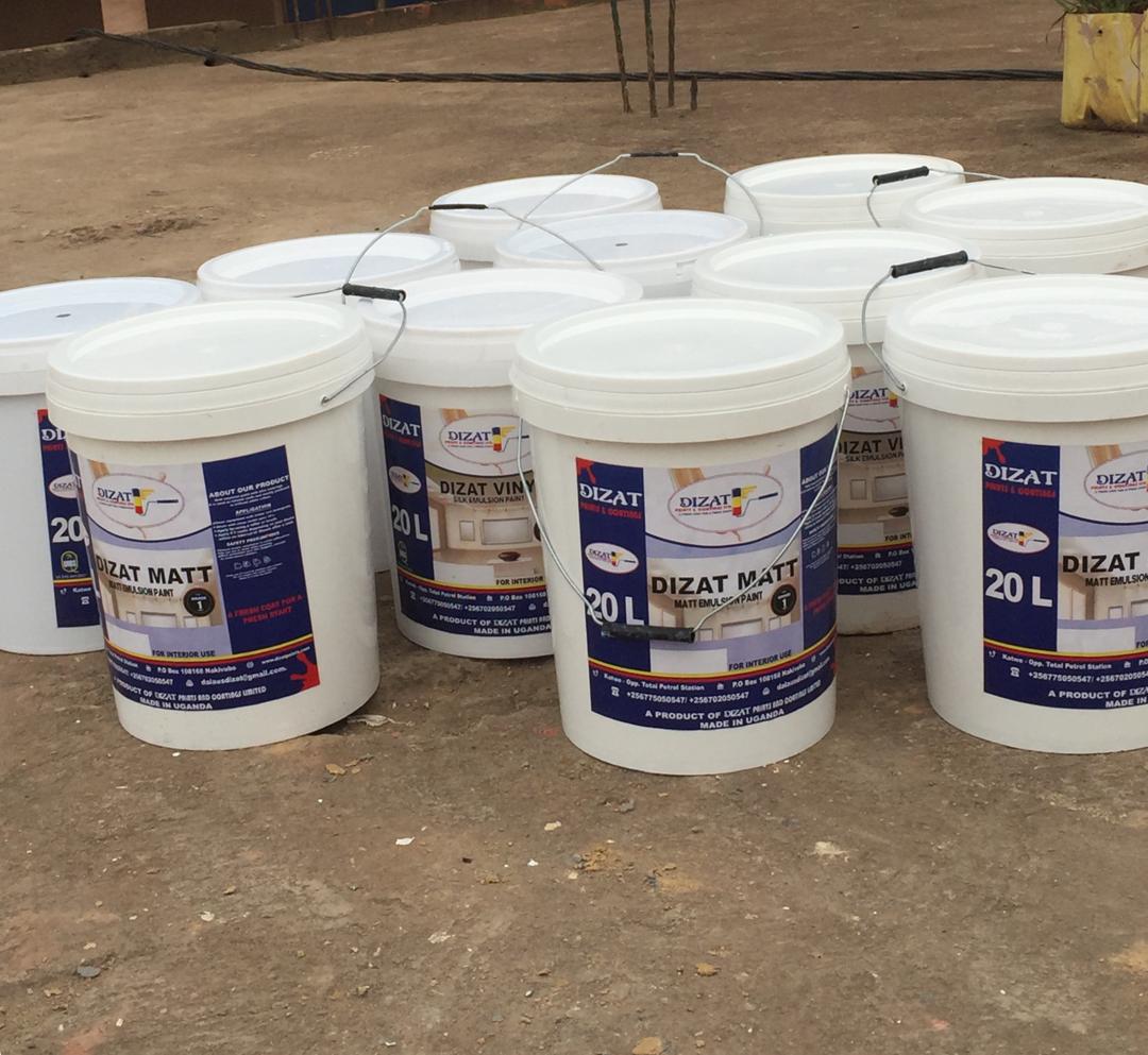 Close view of Dizat Matt emulsion paint buckets staged on site before application