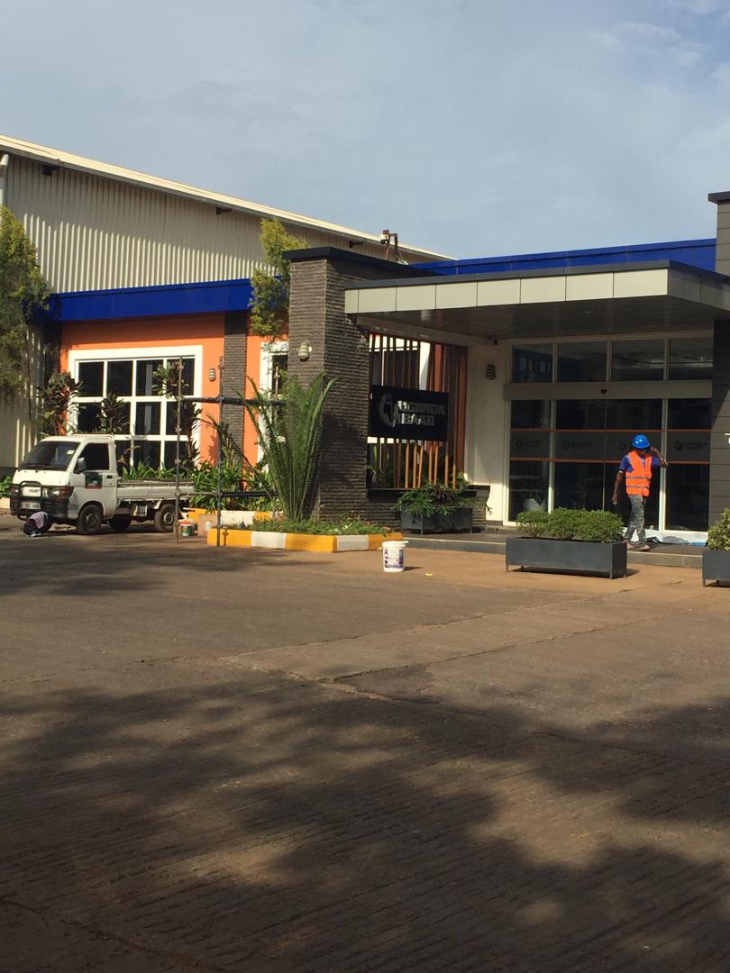 Uganda Baati showroom frontage with painter and branded Dizat delivery vehicle