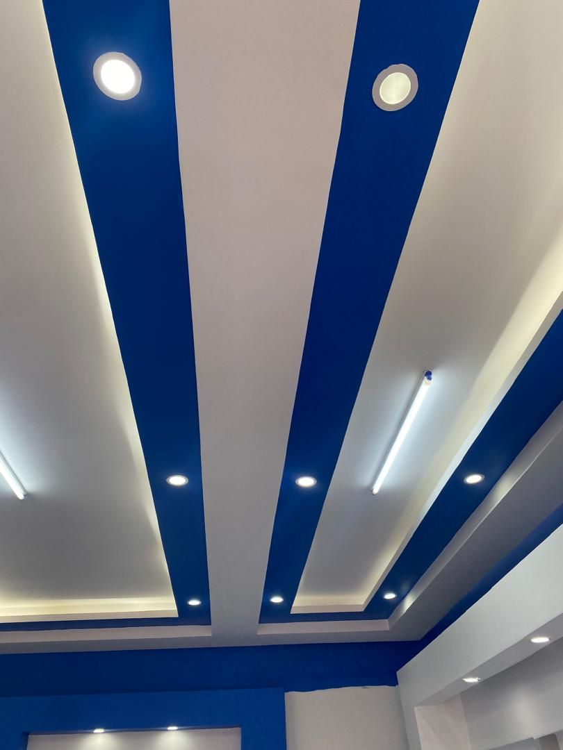 Decorative ceiling paint detail with cove lighting