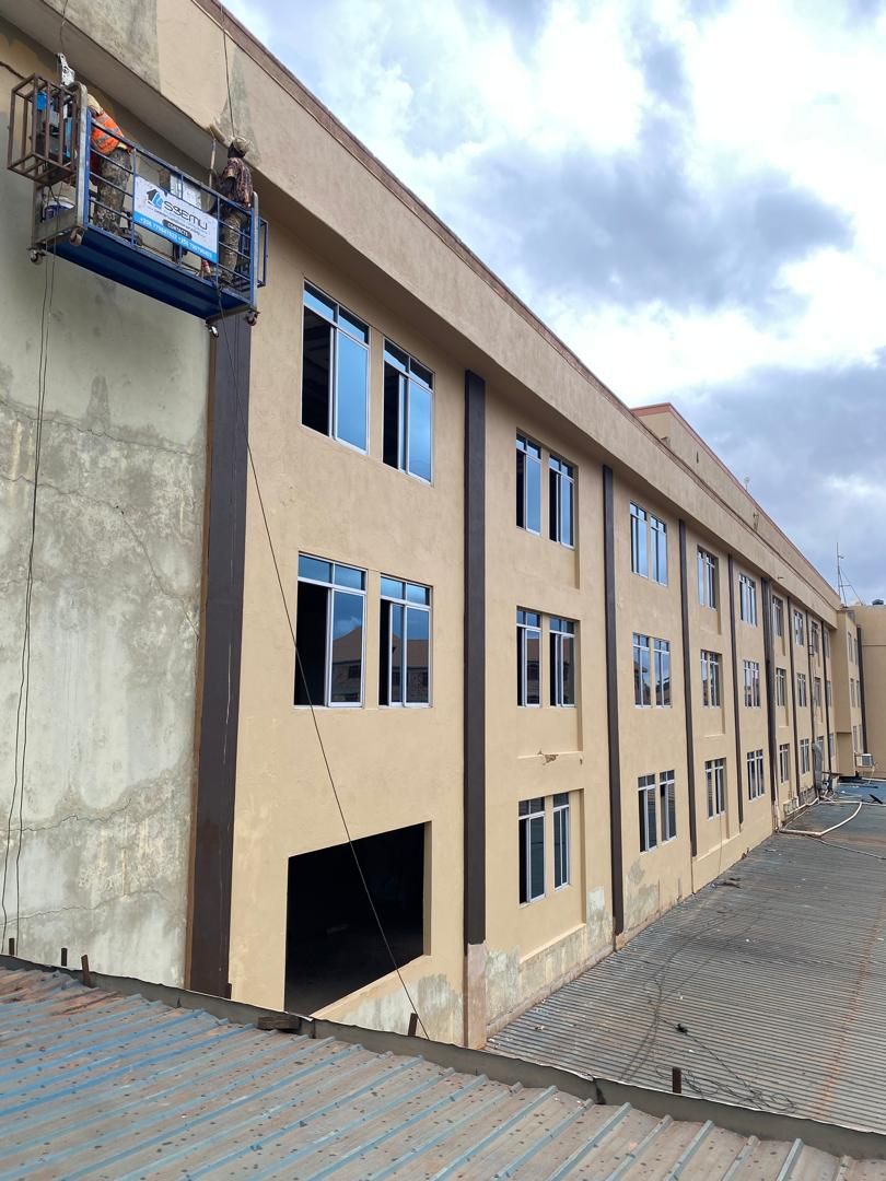 Multi-storey commercial building exterior repaint with access lift