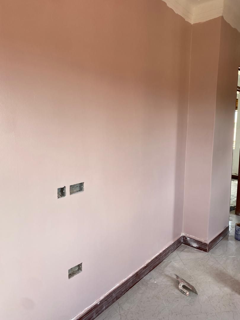 Wall prepared for painting with patched sockets